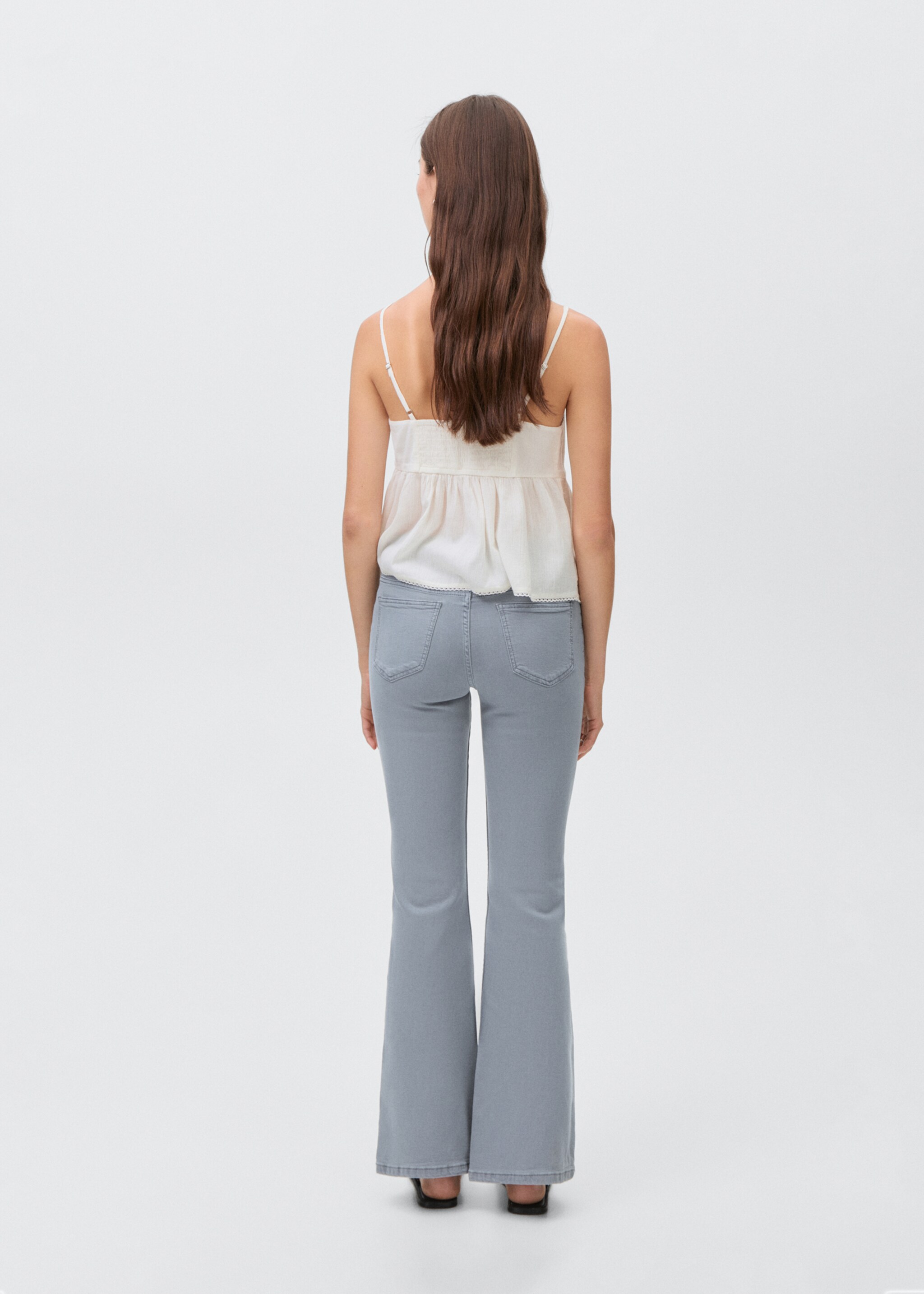 Flared jeans with opening - Reverse of the article