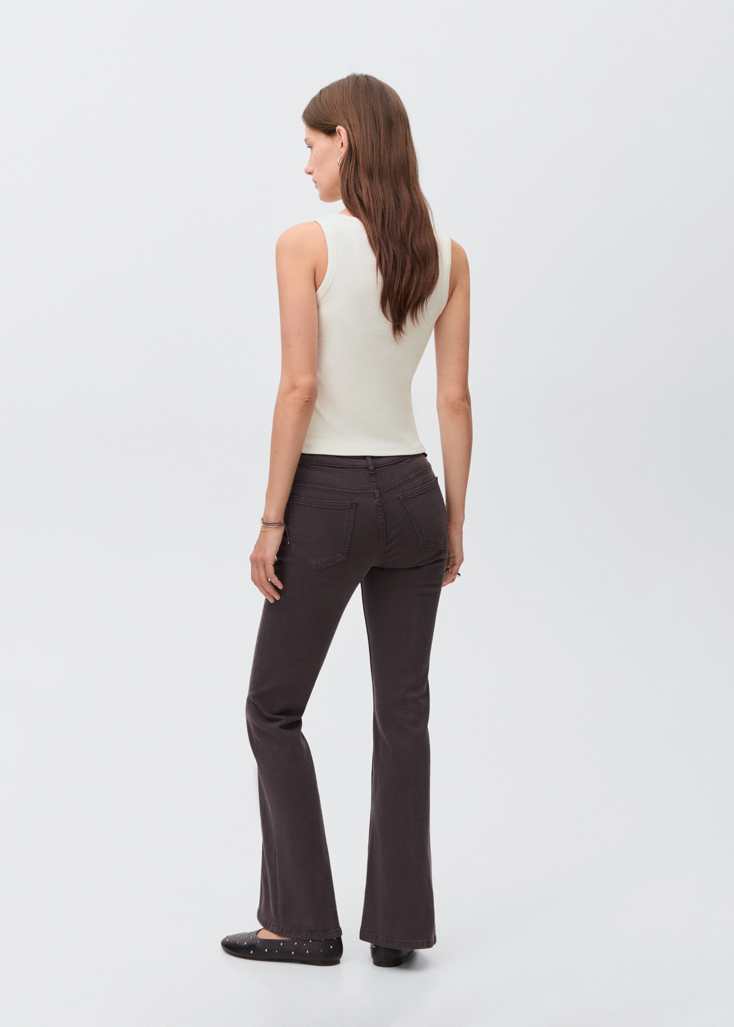 Flared jeans with opening - Reverse of the article