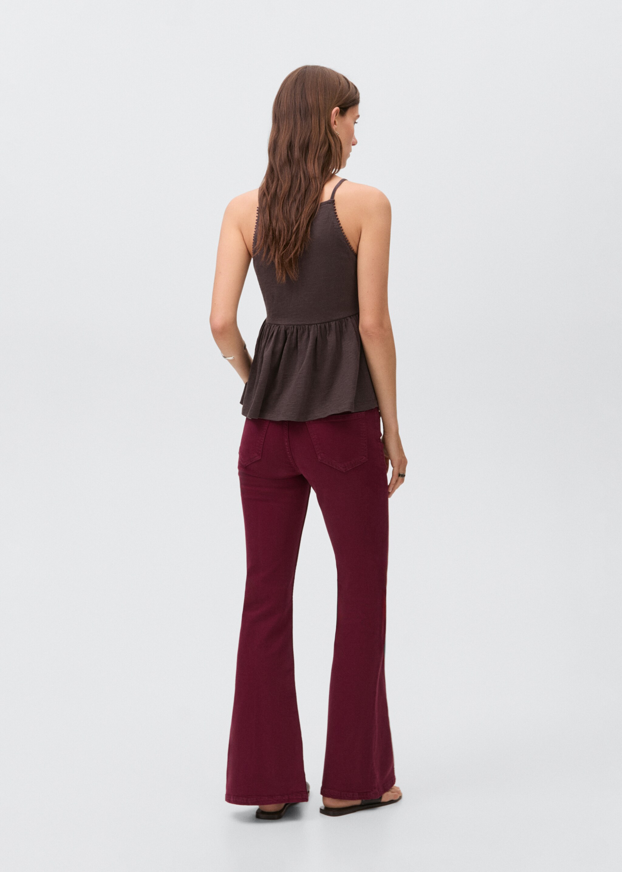 Flared jeans with opening - Reverse of the article