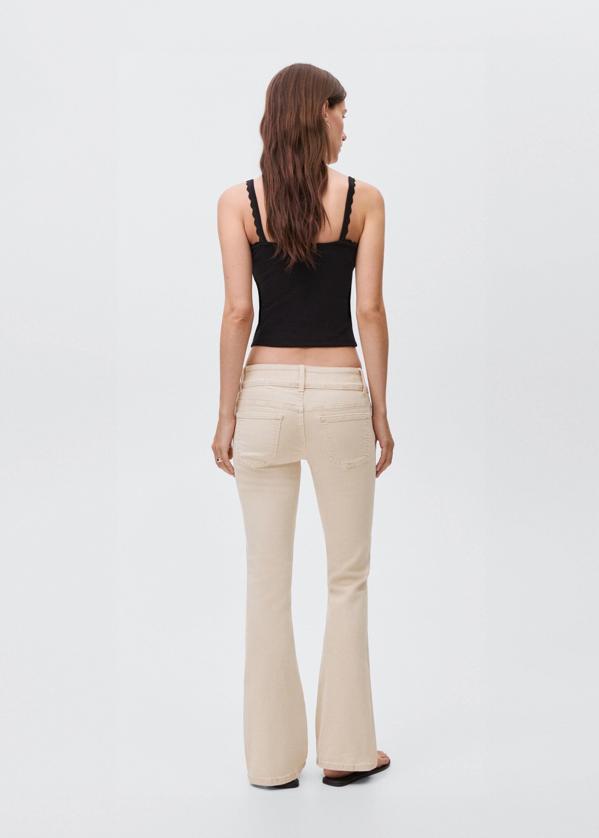 Low-waist flared jeans - Reverse of the article