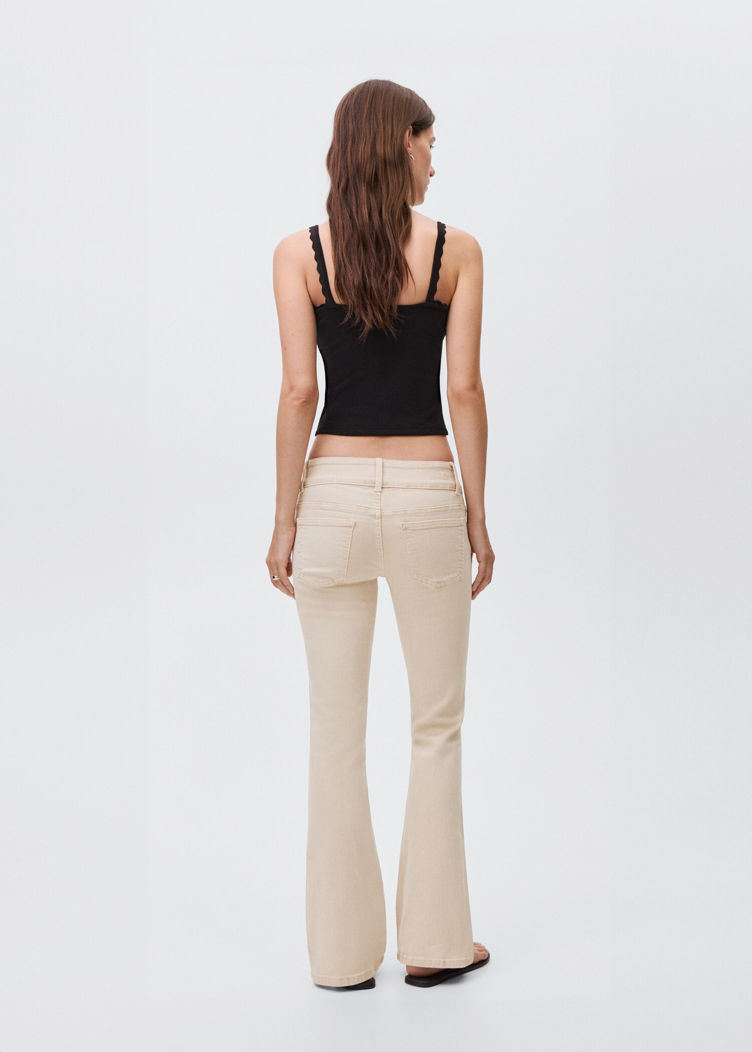 Low-waist flared jeans - Reverse of the article