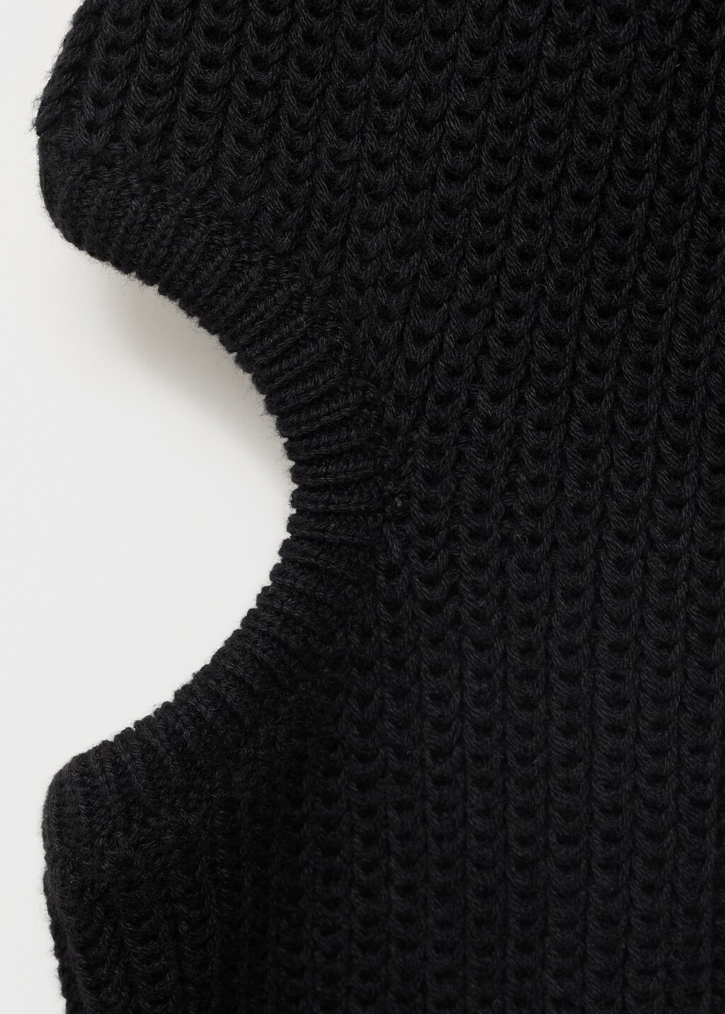 Knitted sweater with openings