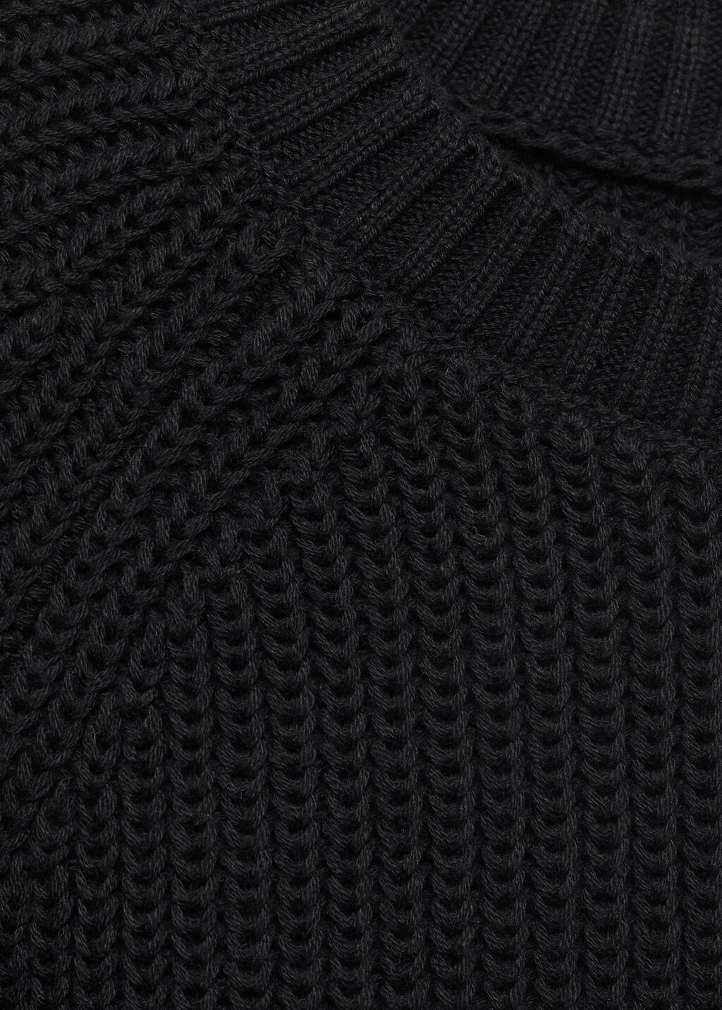 Knitted sweater with openings