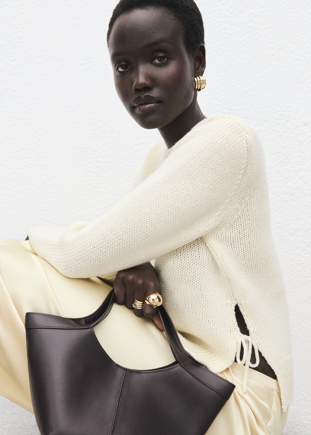 Knitted sweater with tie slits