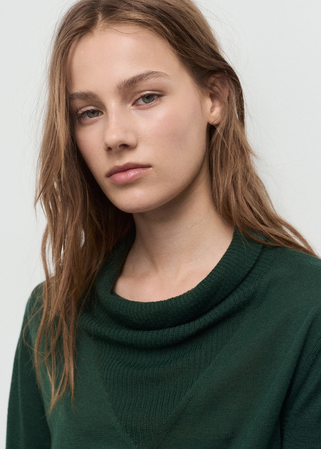 Knitted sweater with draped neck