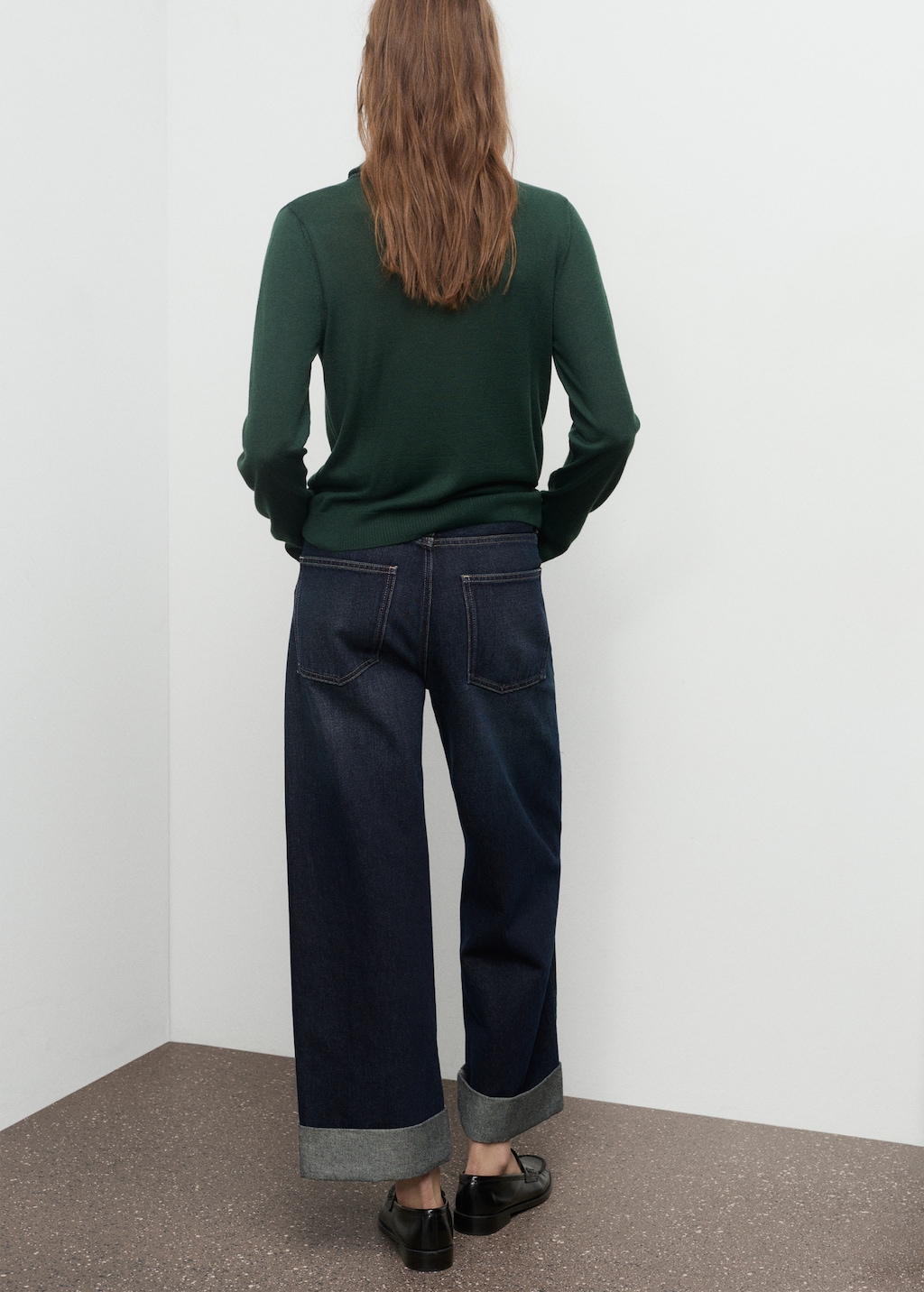 Knitted sweater with draped neck