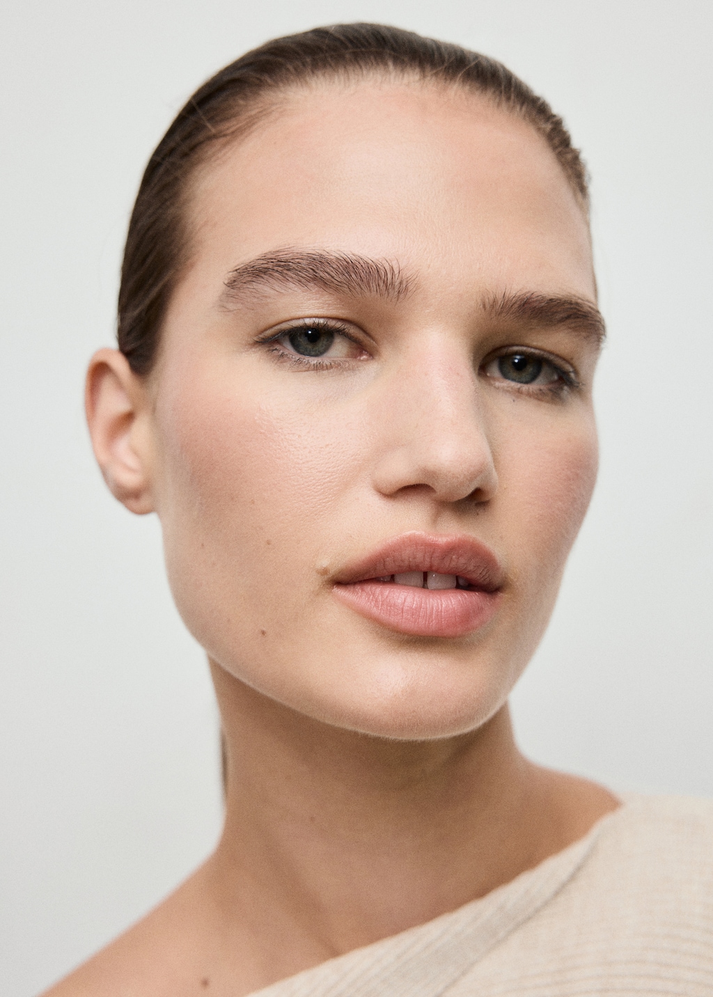 Sweater with asymmetrical neck and jewel buttons