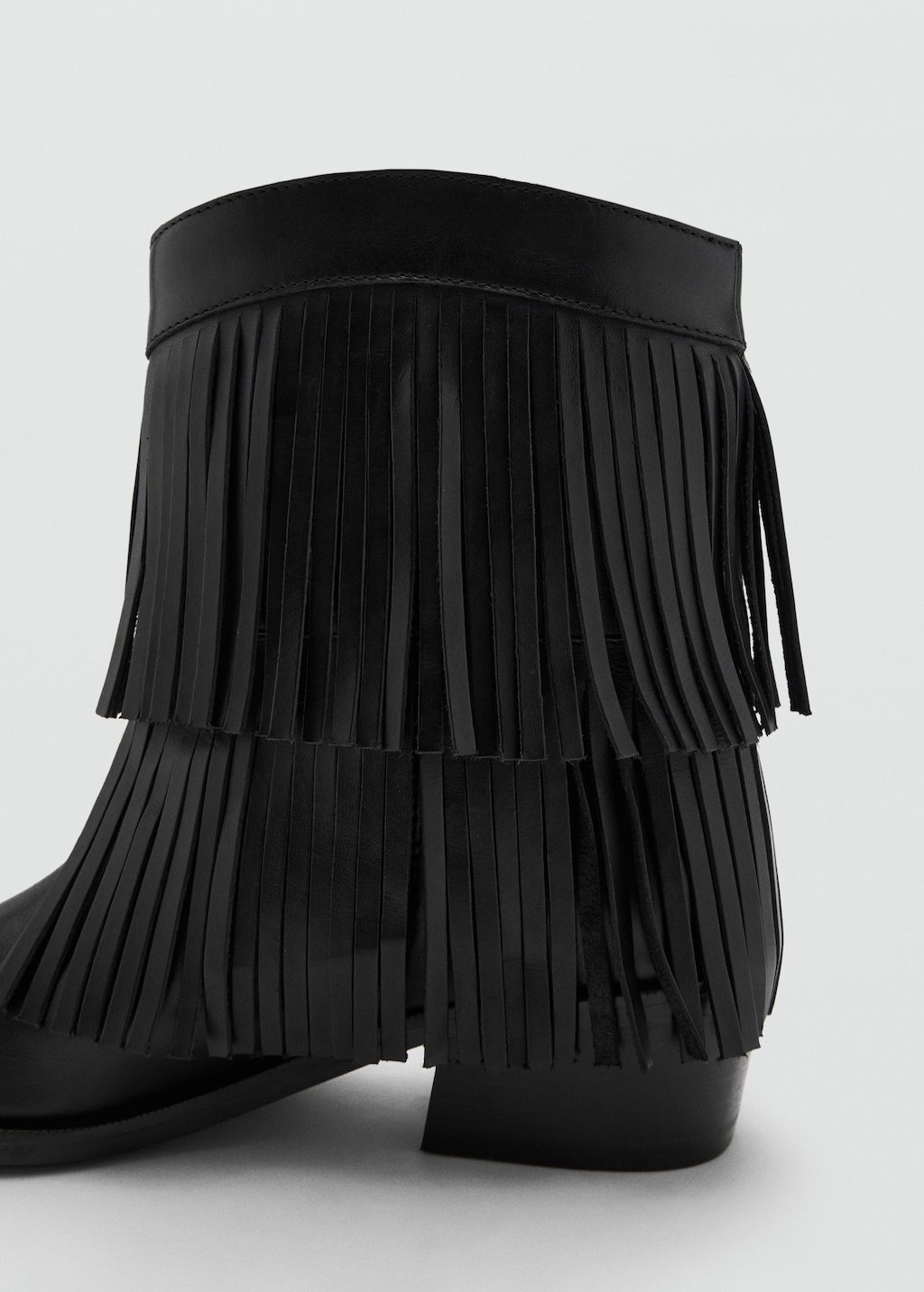 Leather ankle boot with fringe heel