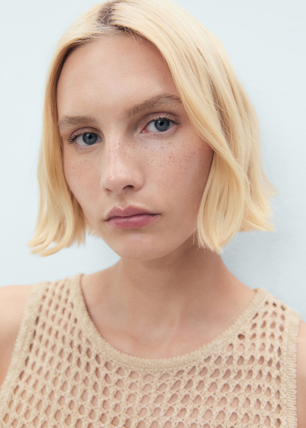 Floral-embroidered crochet top