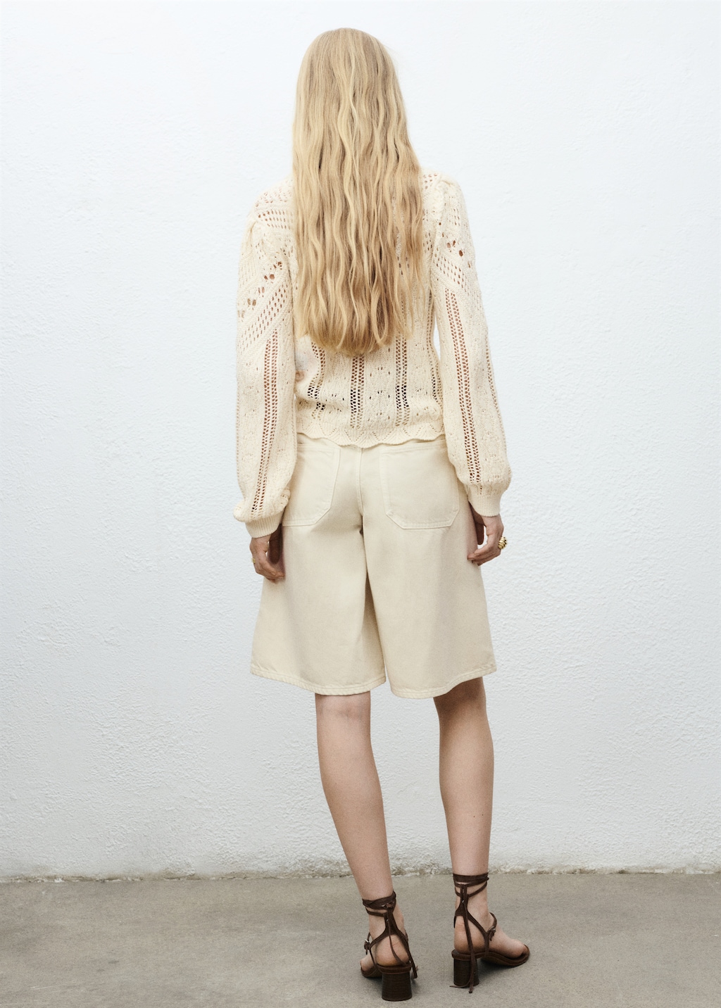 Knitted sweater with lace accents