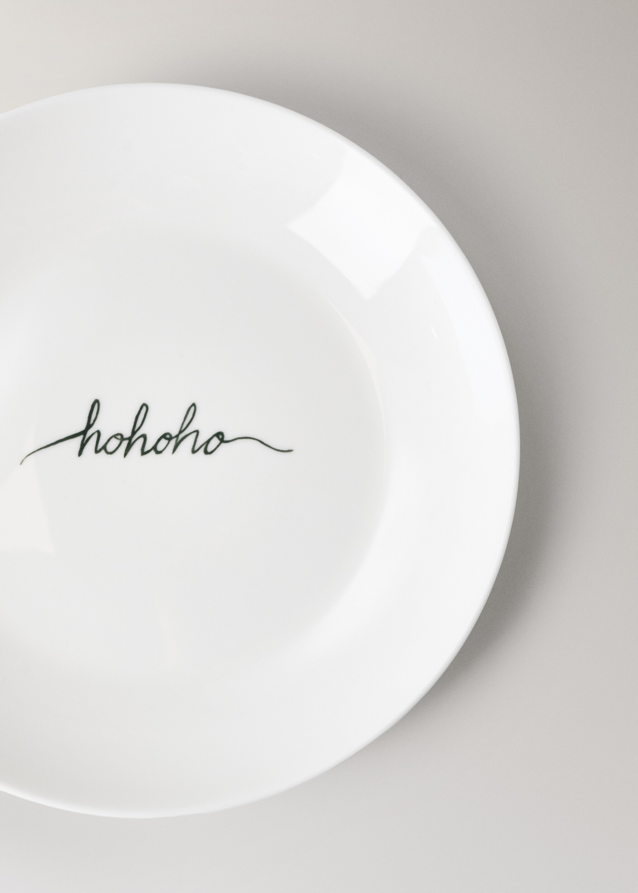 Bonechina dessert plate, detail, Christmas phrase - Details of the article 1, Off White. Ref: 17017911-00.