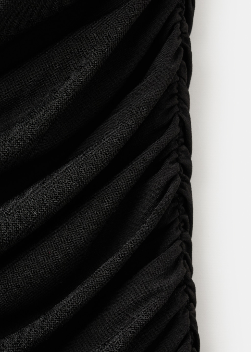 Ruched asymmetrical top with ruffle trim