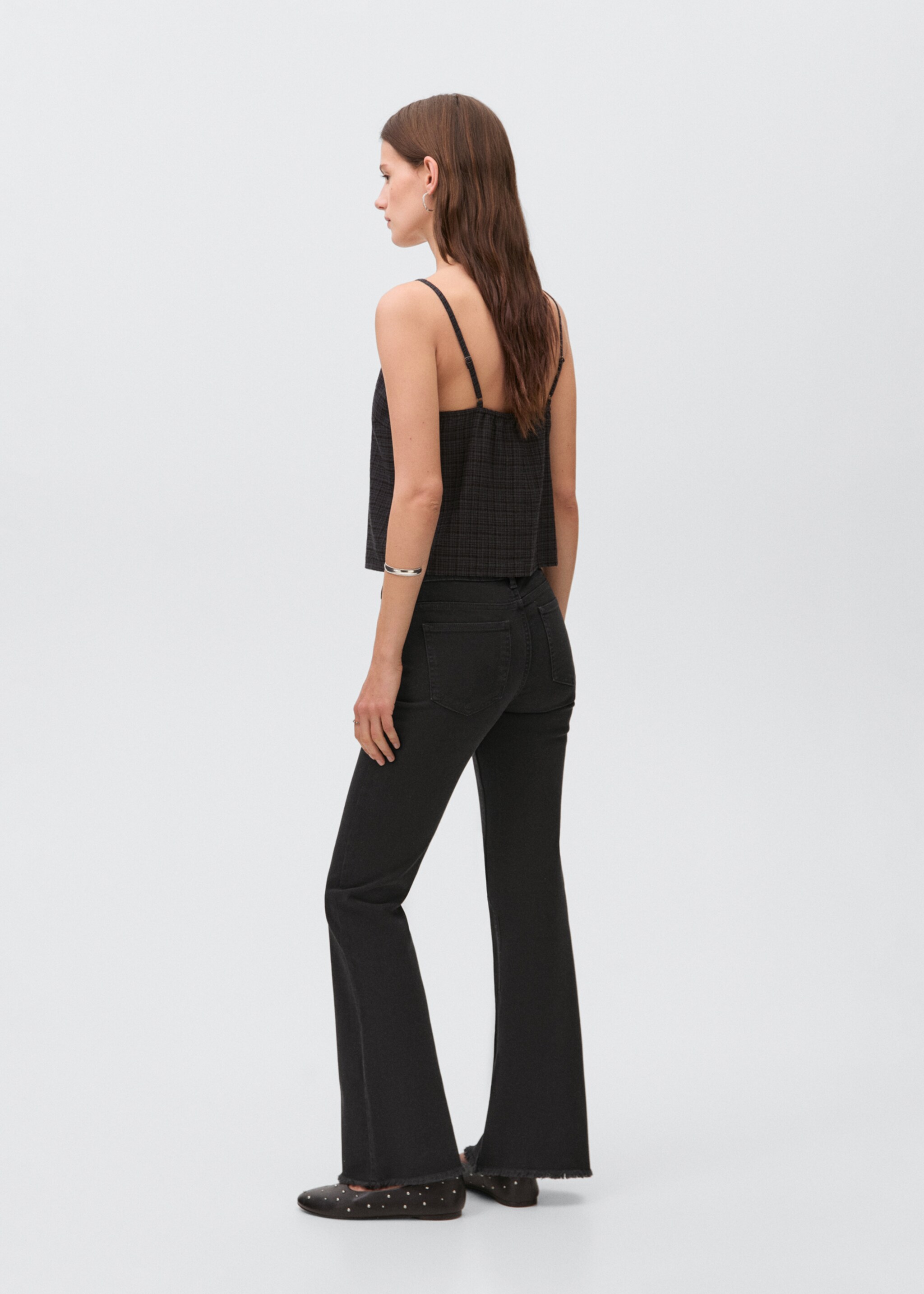 Flared jeans with studs - Reverse of the article