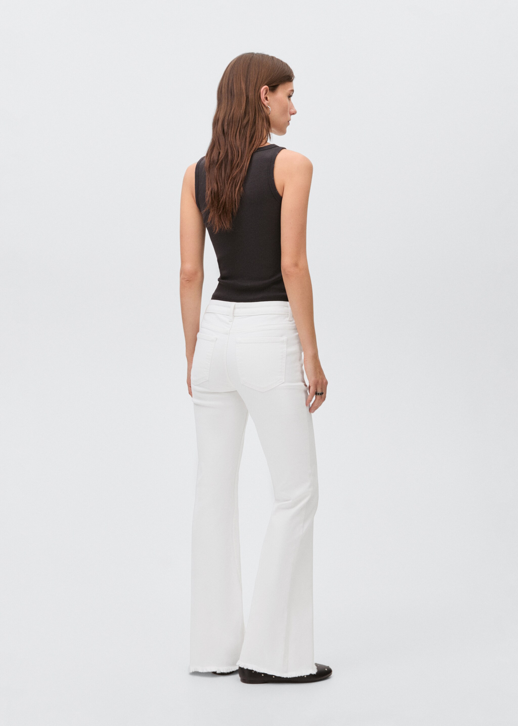 Flared jeans with studs - Reverse of the article