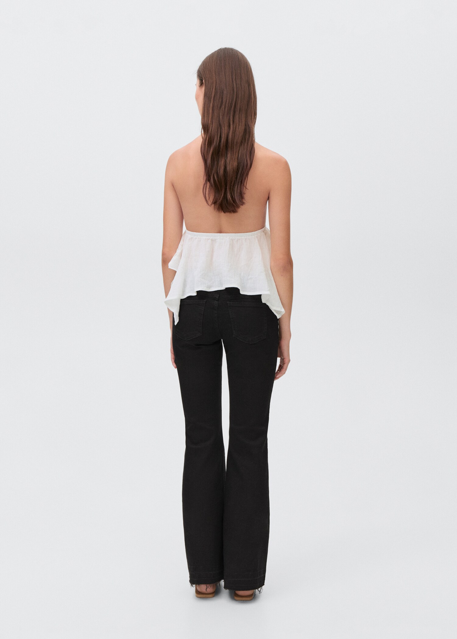 Low-waist flared jeans - Reverse of the article