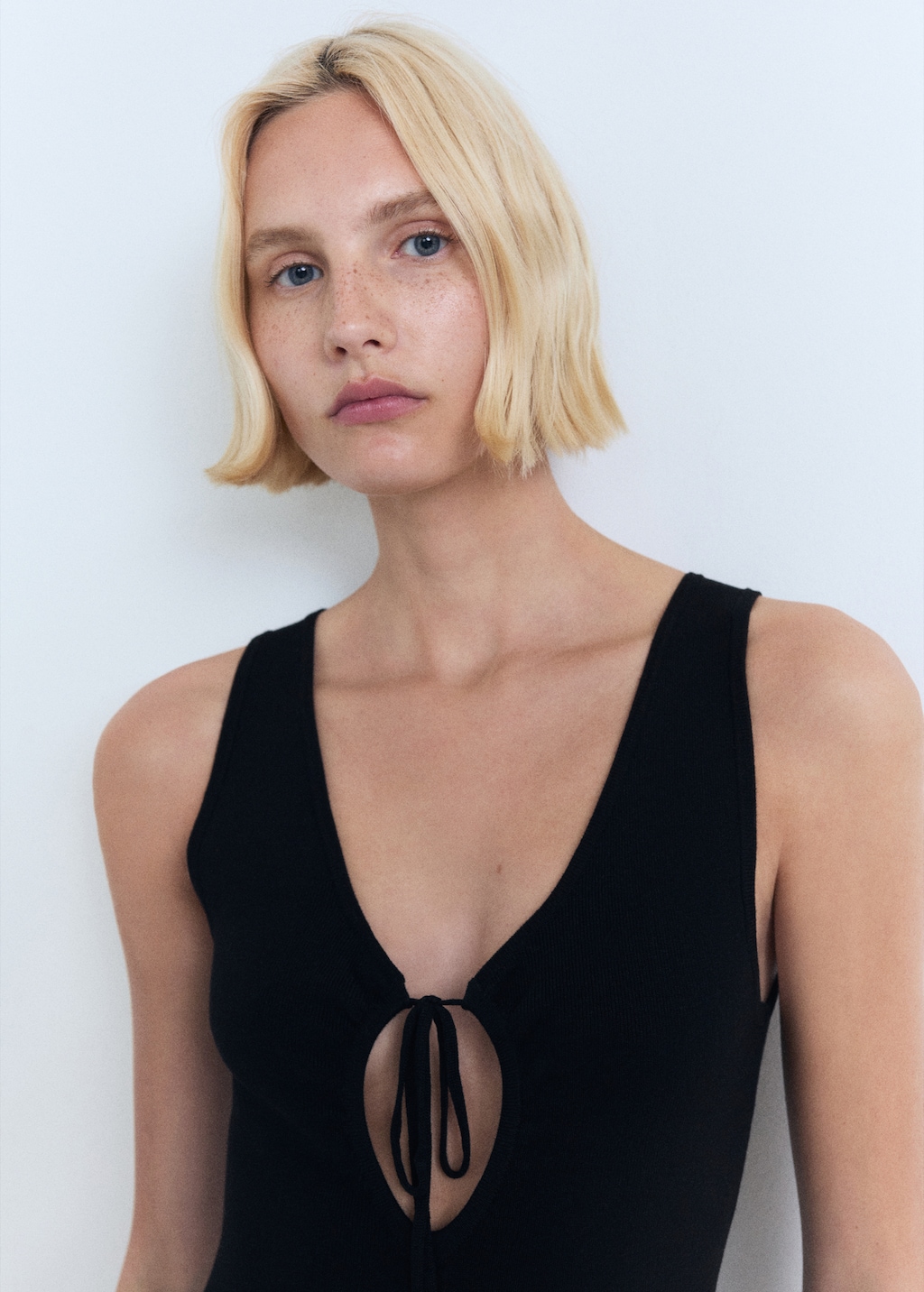 Knitted dress with bow neckline