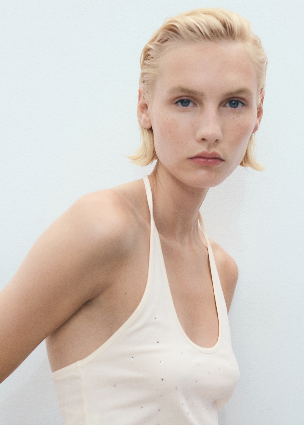 Halter neck top with metallic appliqués