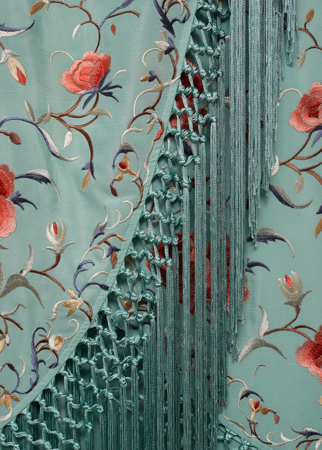 Asymmetrical dress with embroidered fringes