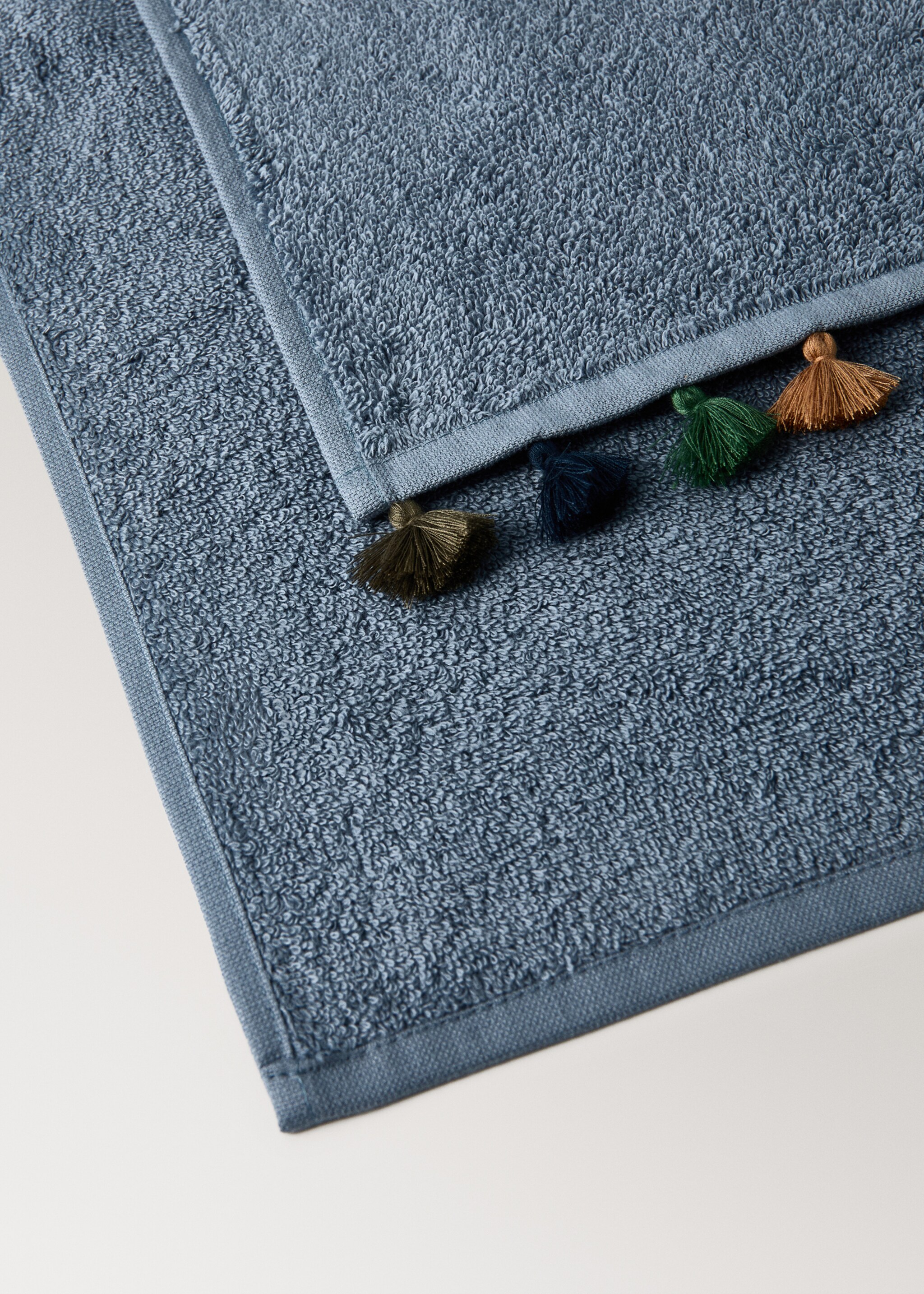Cotton children's multi-coloured hand towel with pompoms - Details of the article 1, Ink Blue. Ref: 17021628-00.