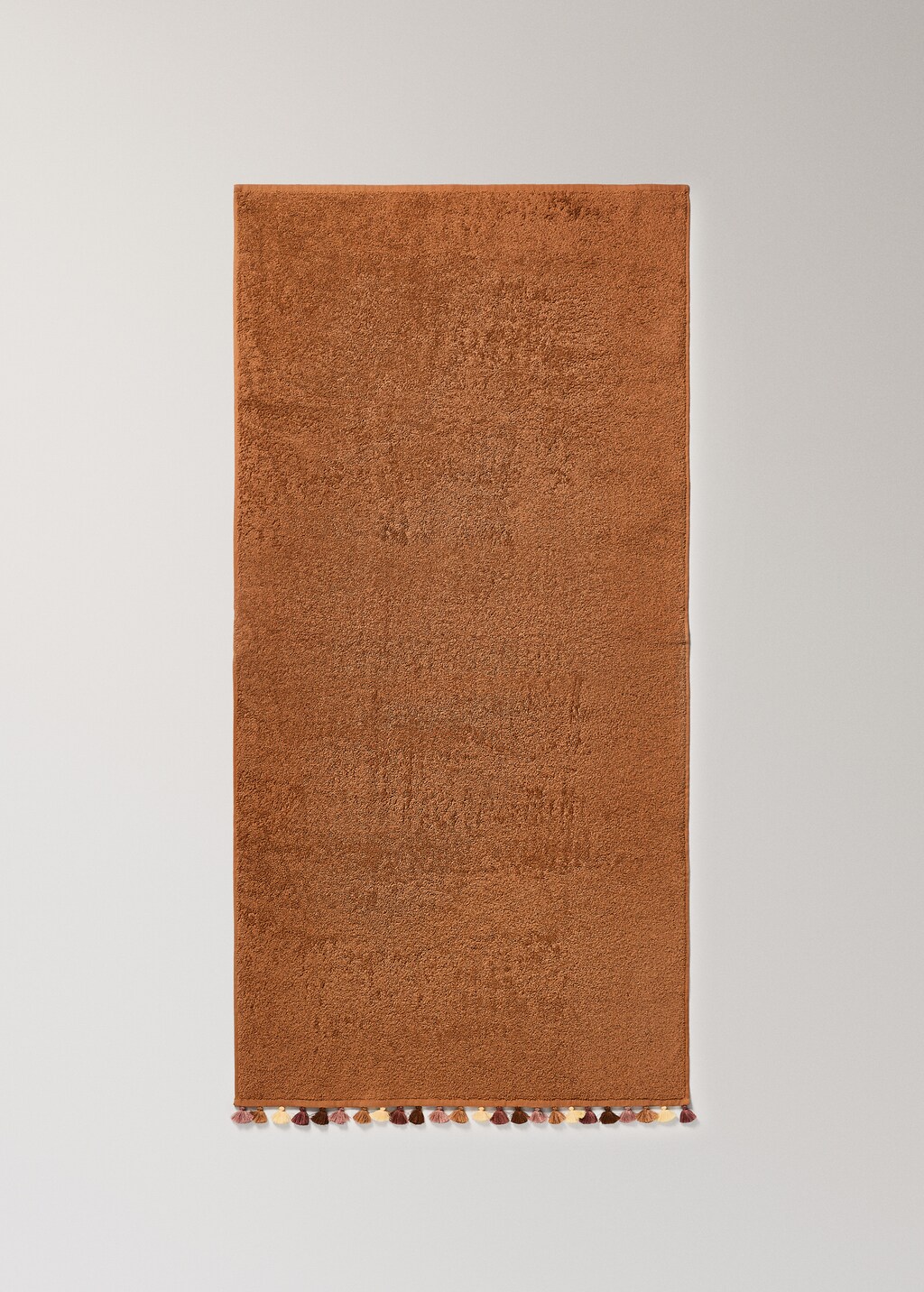 Children's cotton bath towel with multi-colored pom-poms