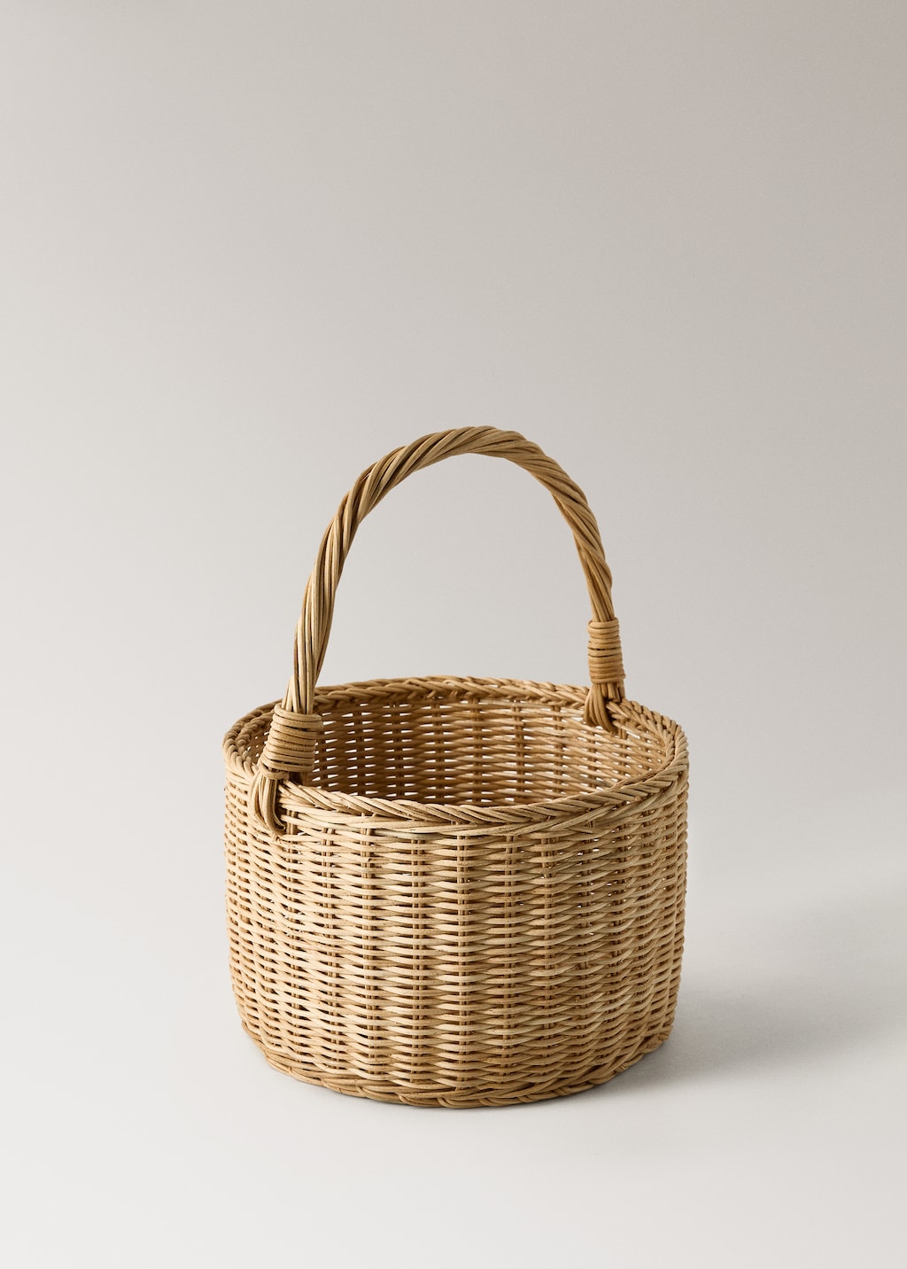Large rattan basket with handles