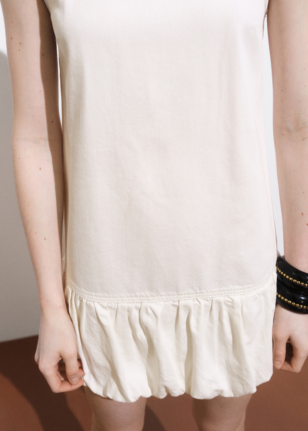 Denim dress with puffed hem