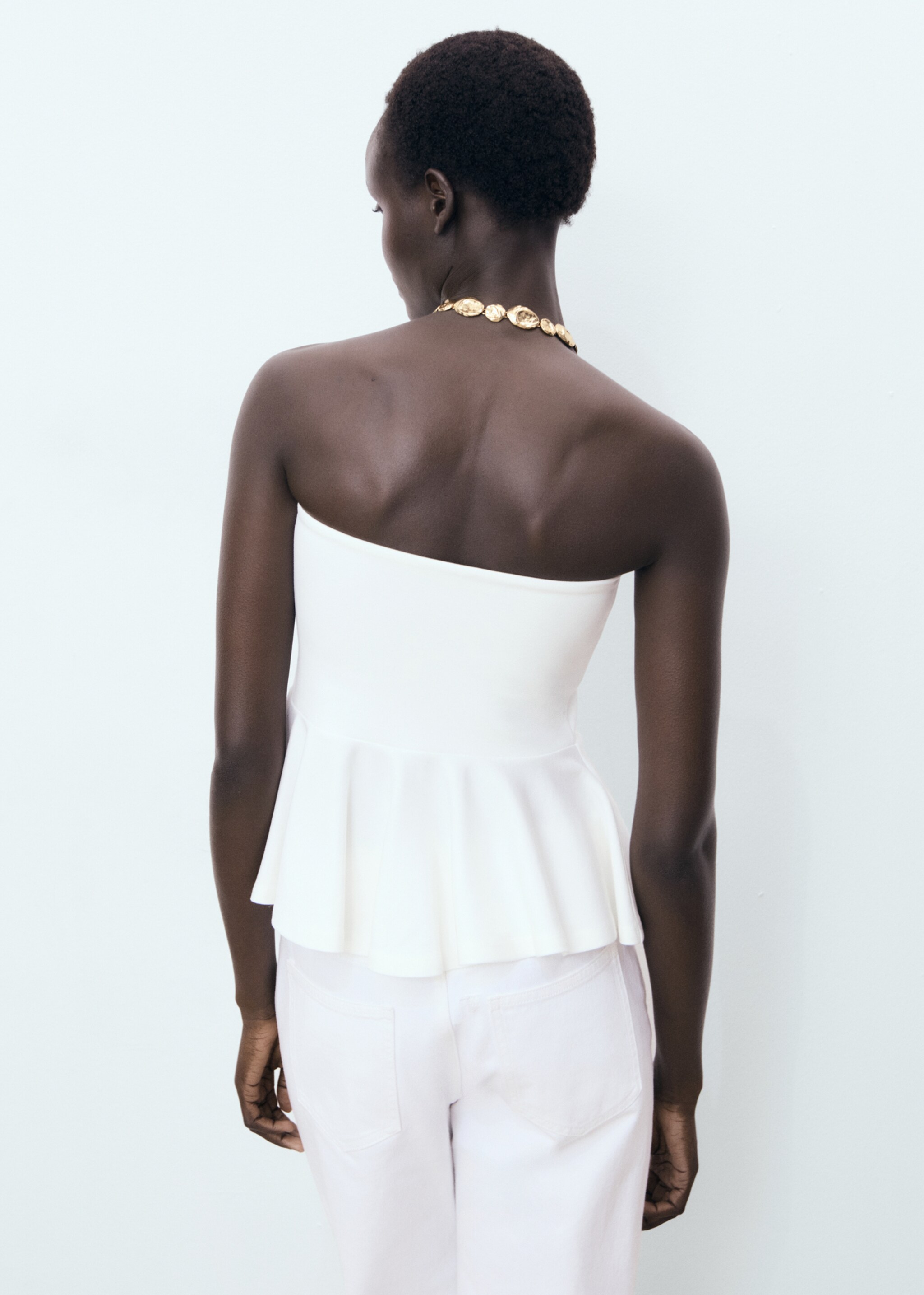 Strapless peplum top - Reverse of the article