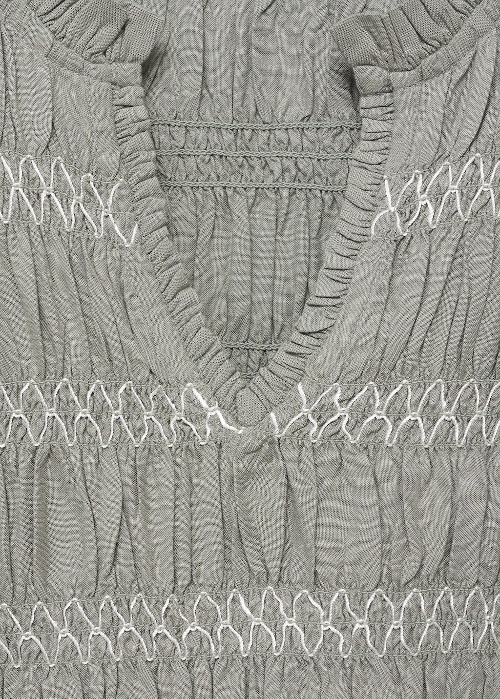 Ruffled blouse with embroidered details