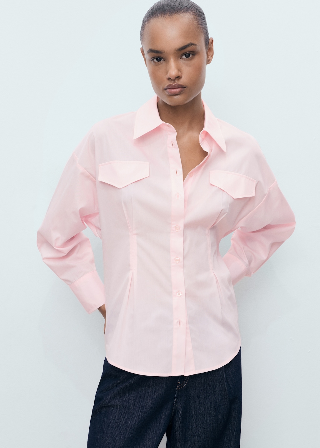 Shirt with pleats and pockets