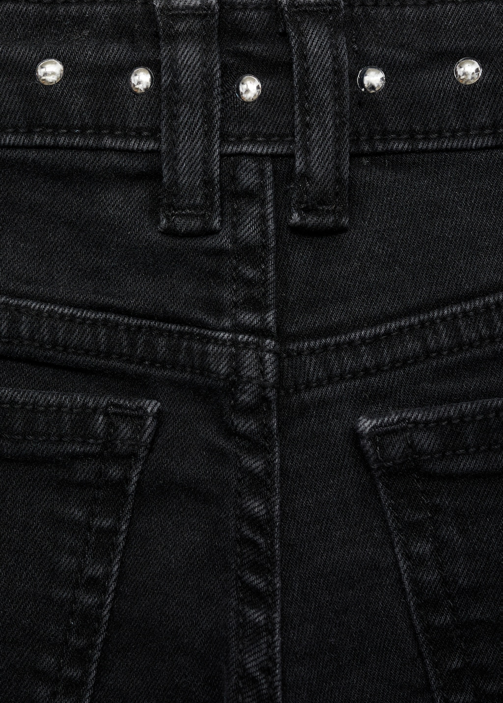 Low-waist studded jeans