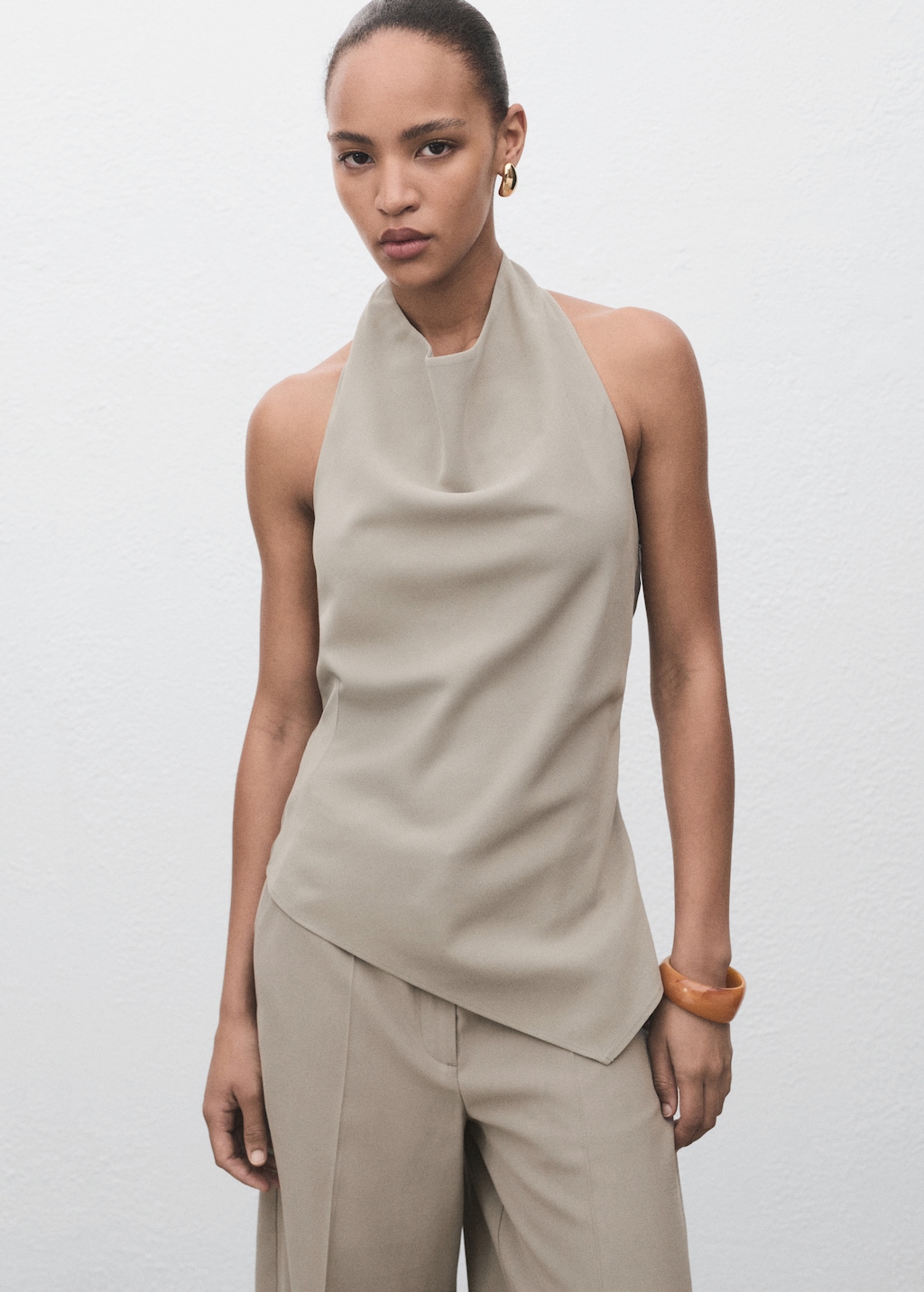 Asymmetrical open-back top