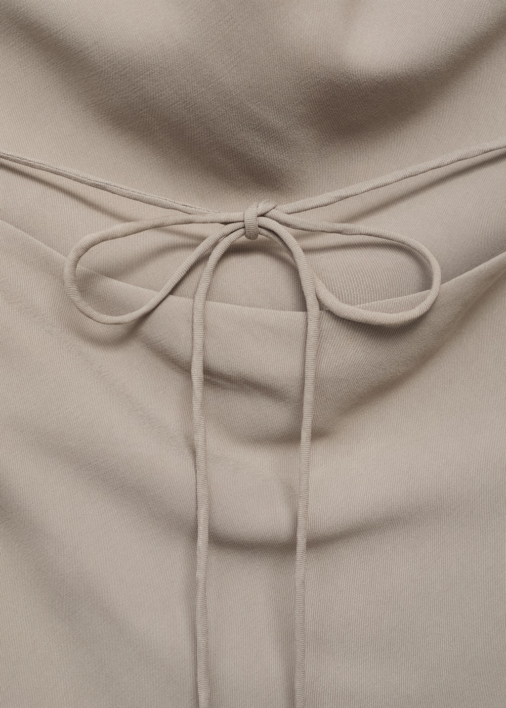 Asymmetrical open-back top