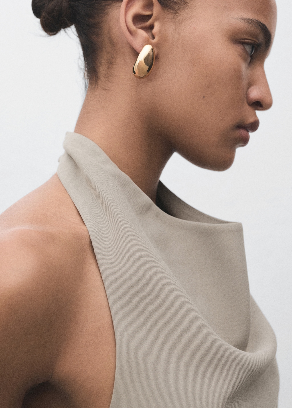 Asymmetrical open-back top