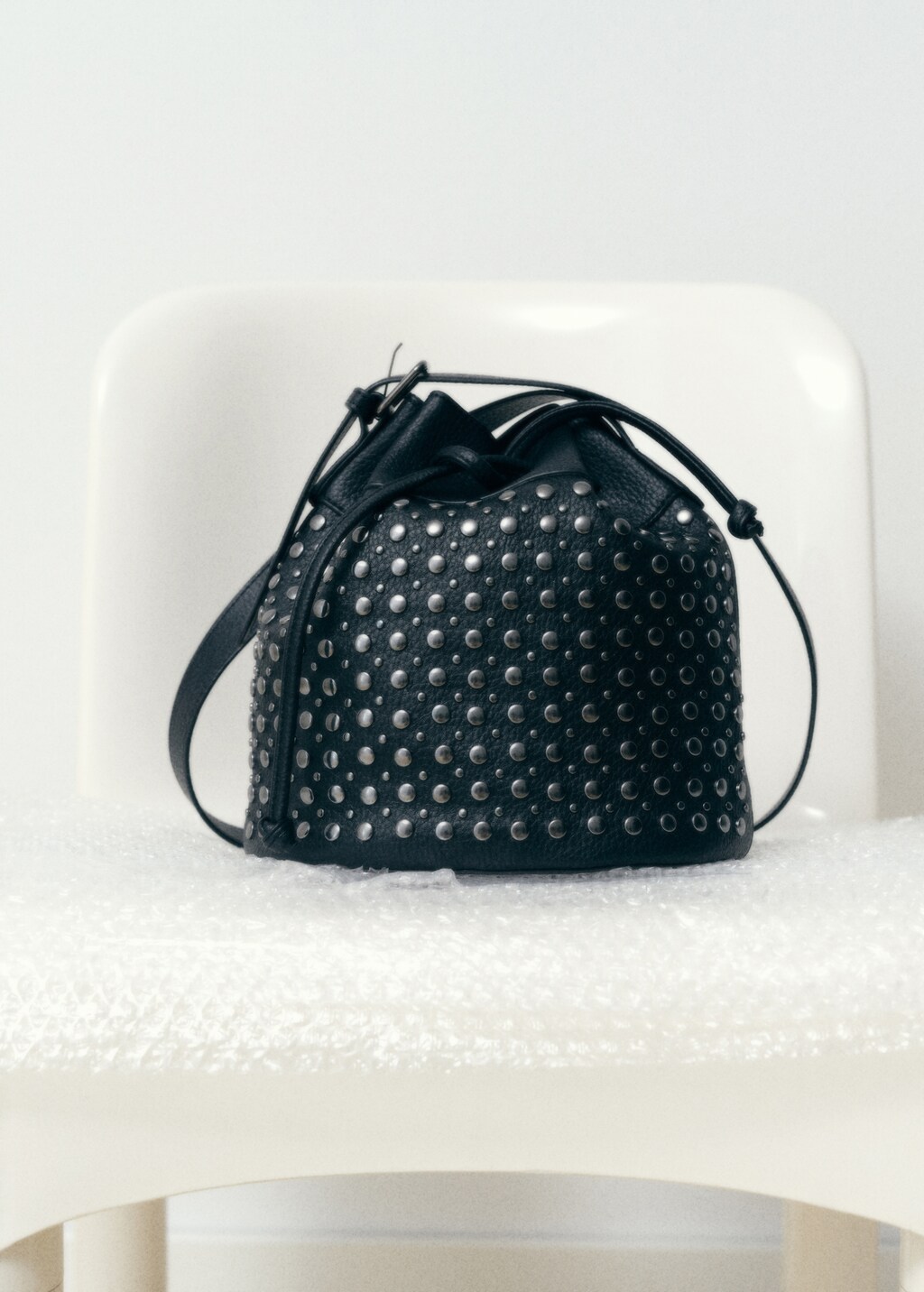 Studded bucket bag