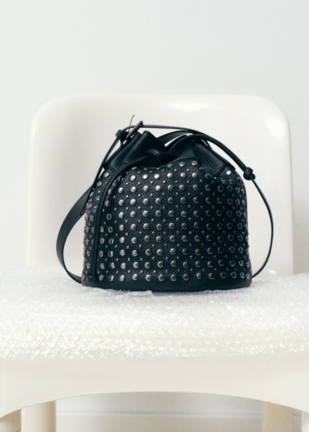 Studded bucket bag