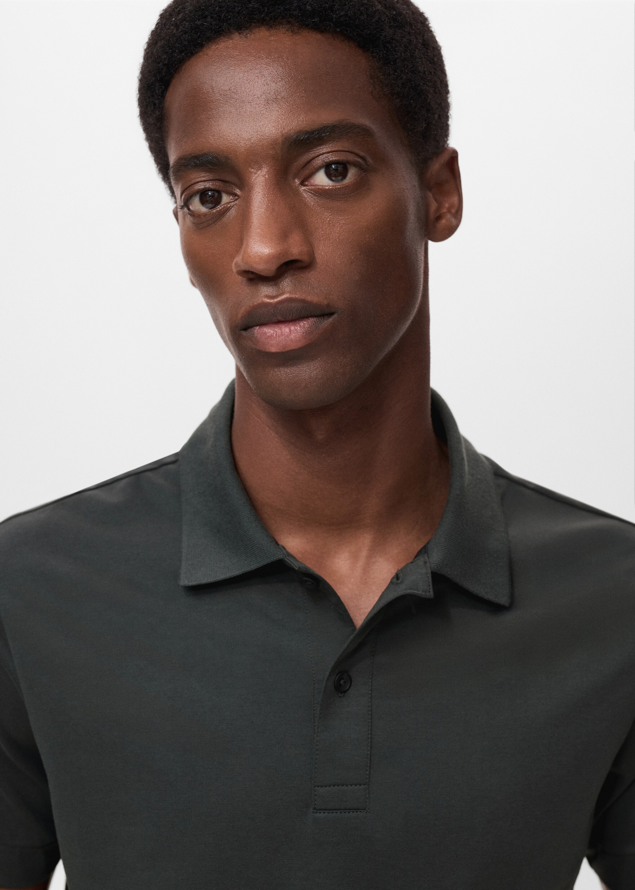 Slim-fit Thermolite® polo shirt - Details of the article 1, Dark Green. Ref: 17035977-00.