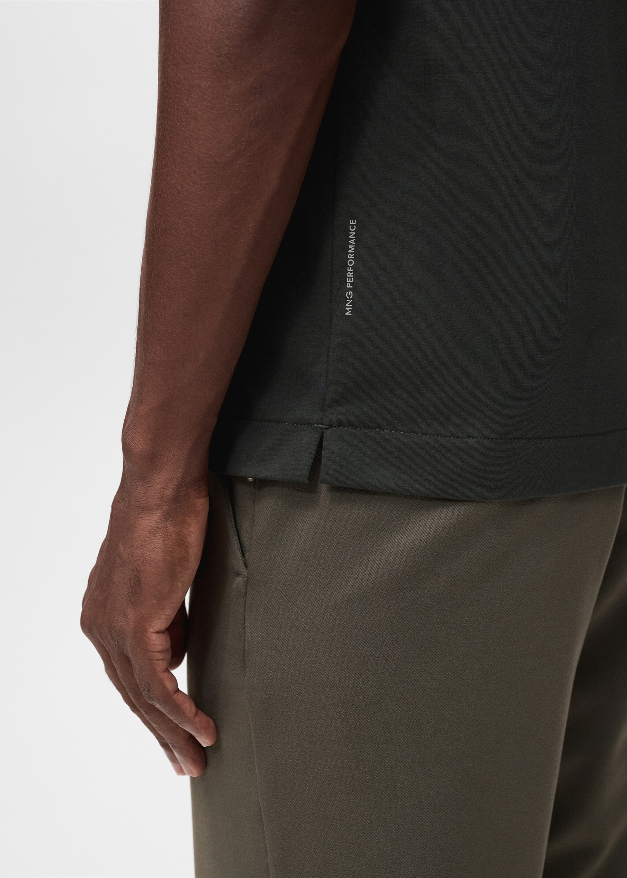 Slim-fit Thermolite® polo shirt - Details of the article 6, Dark Green. Ref: 17035977-00.