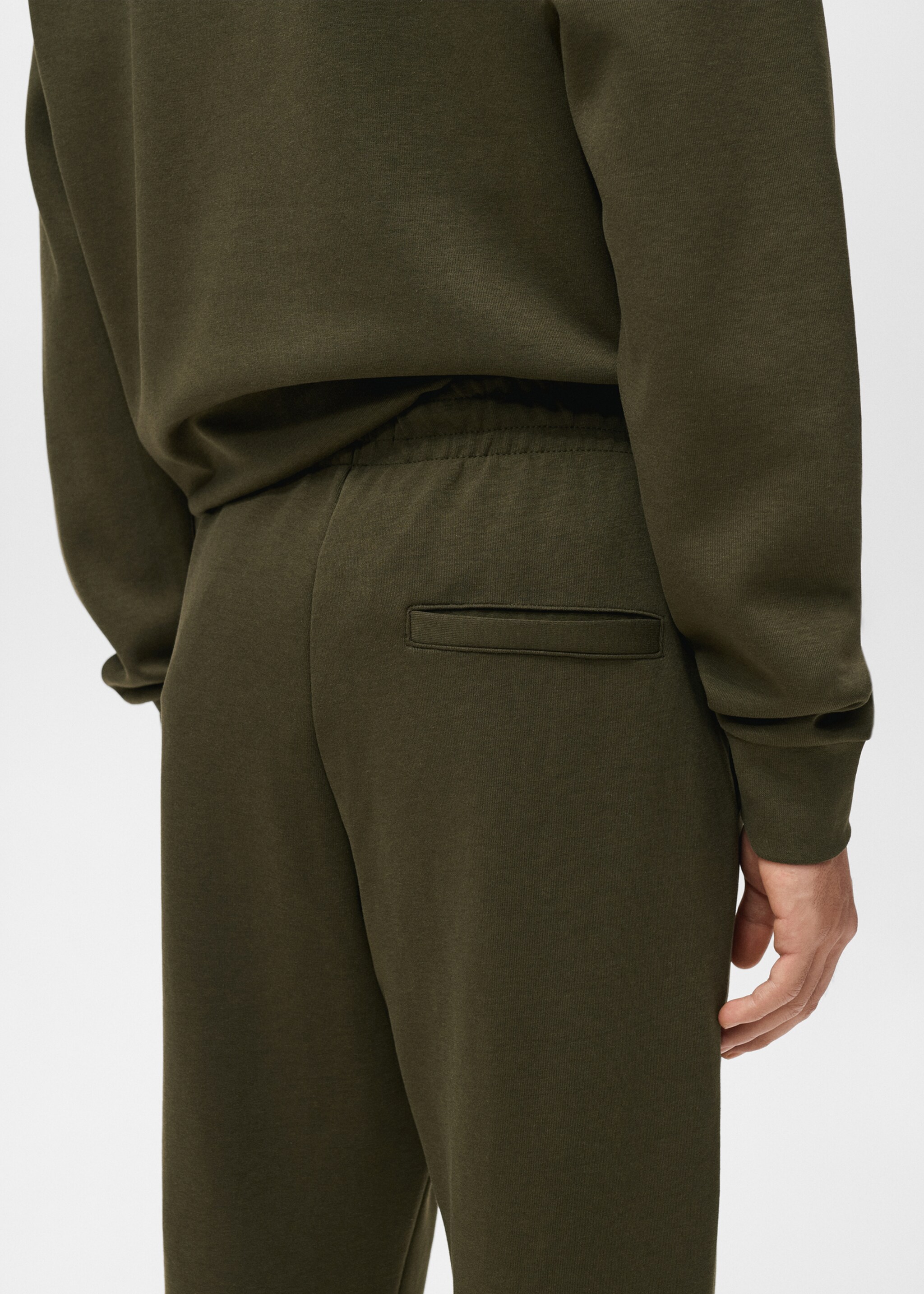 Cotton joggers with elastic waist - Details of the article 6, Olive Green. Ref: 17035978-00.