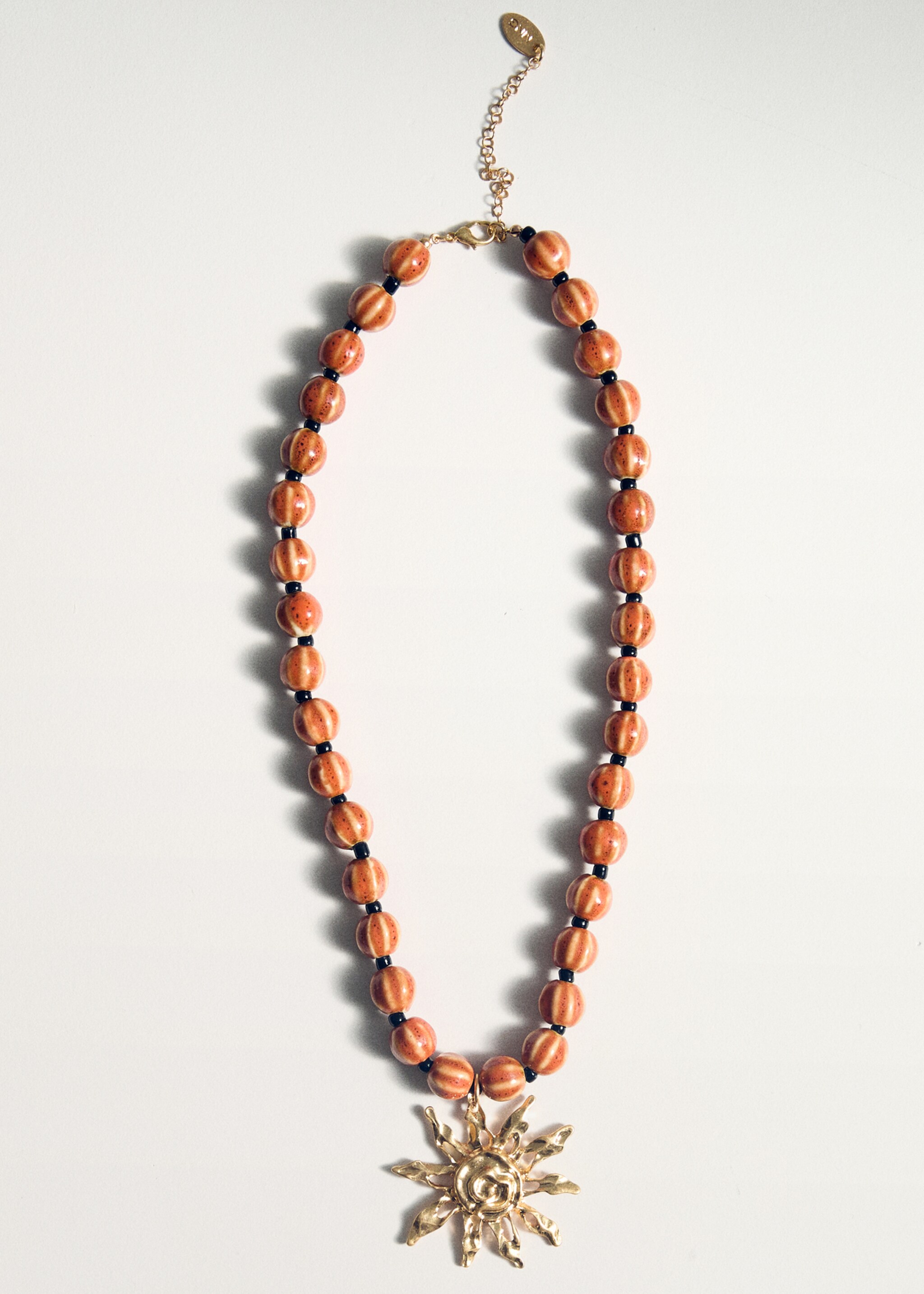 Ceramic ball necklace with sun pendant - Details of the article 5
