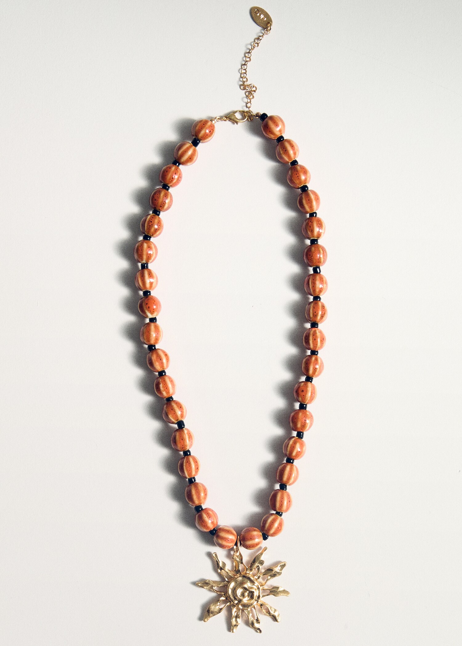 Ceramic ball necklace with sun pendant - Details of the article 5