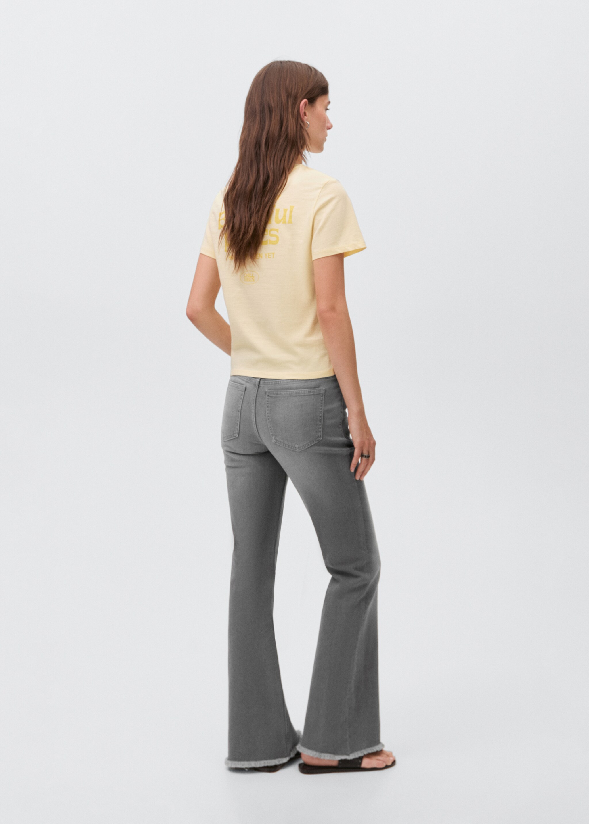 Flared jeans with studs - Reverse of the article