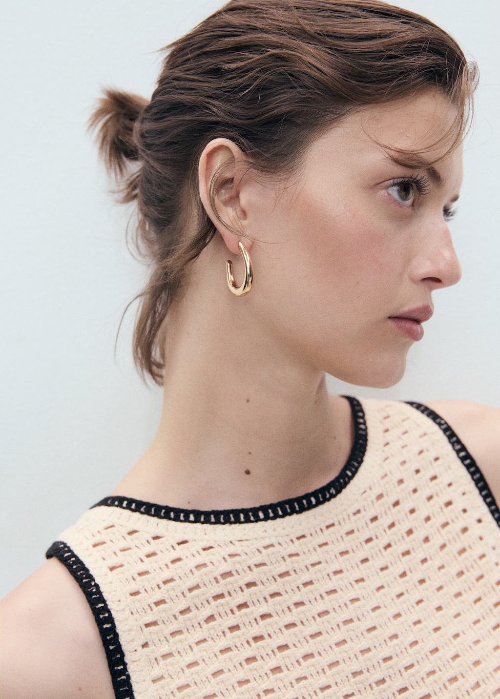 Crochet top with floral finishes