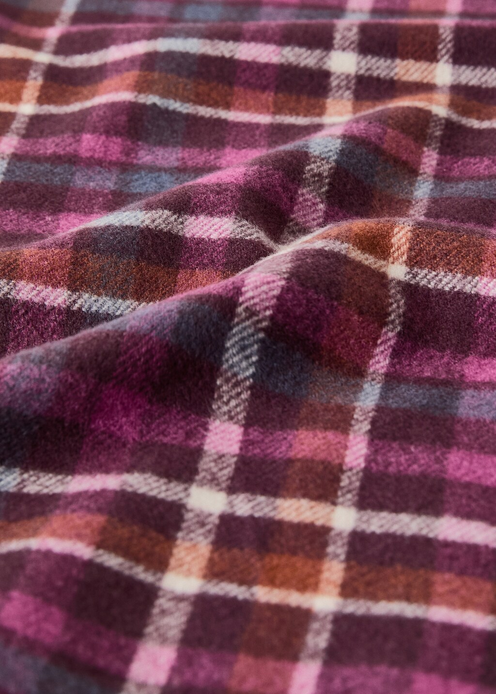 Fringed blanket with check design