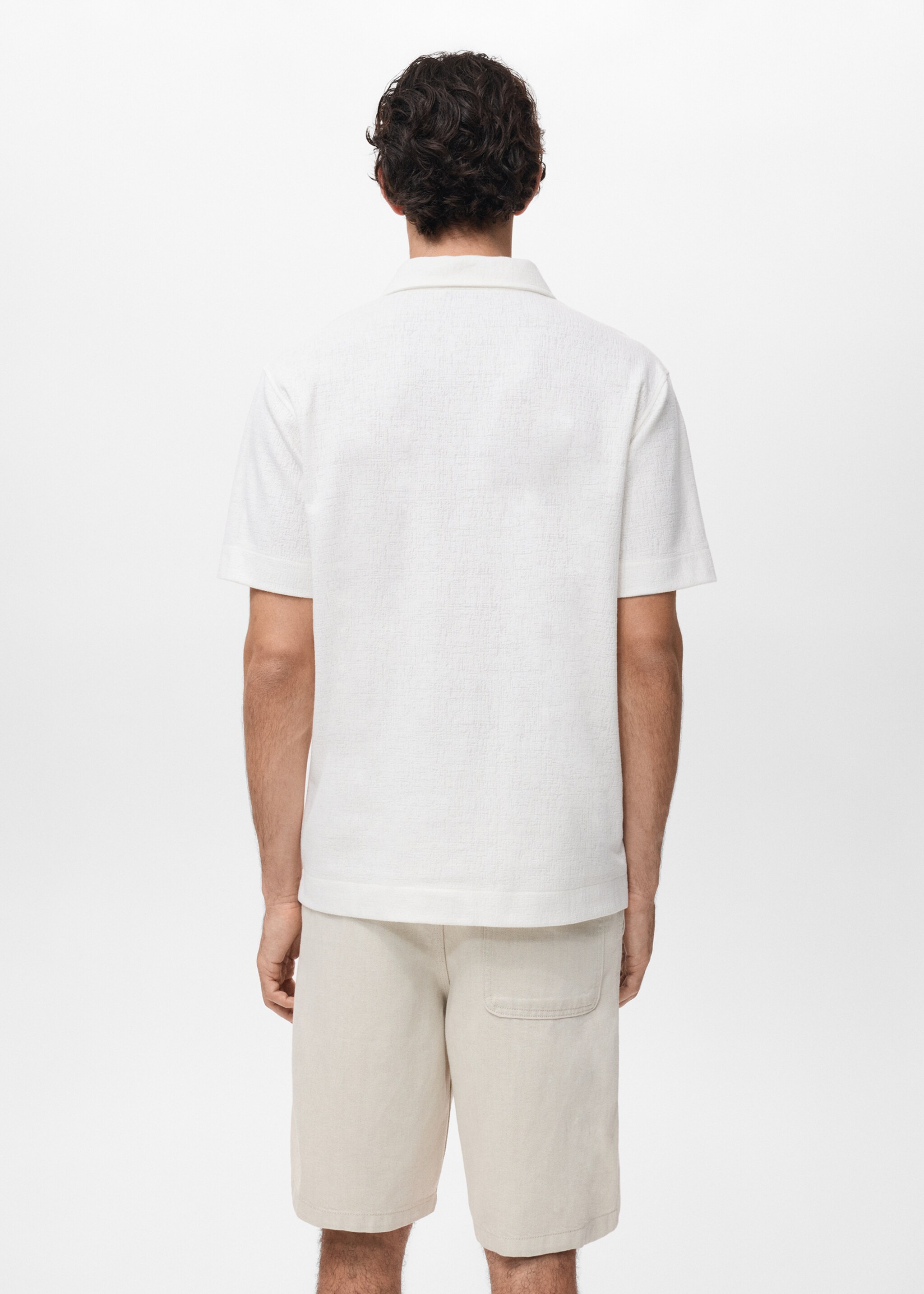 Structured knitted polo shirt - Reverse of the article