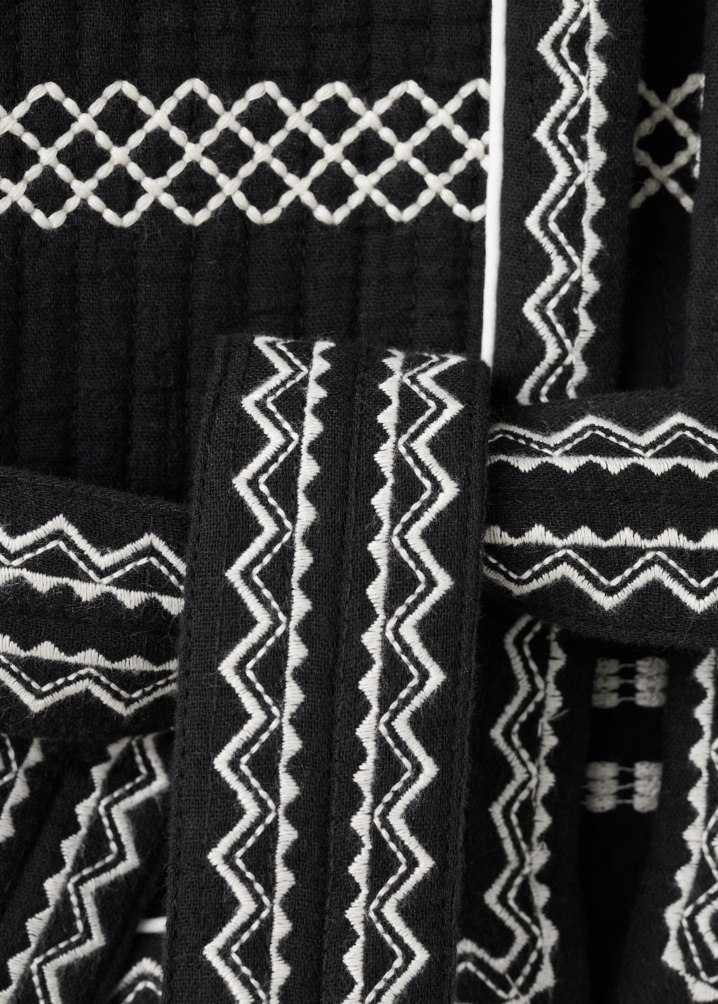 Embroidered vest with belt