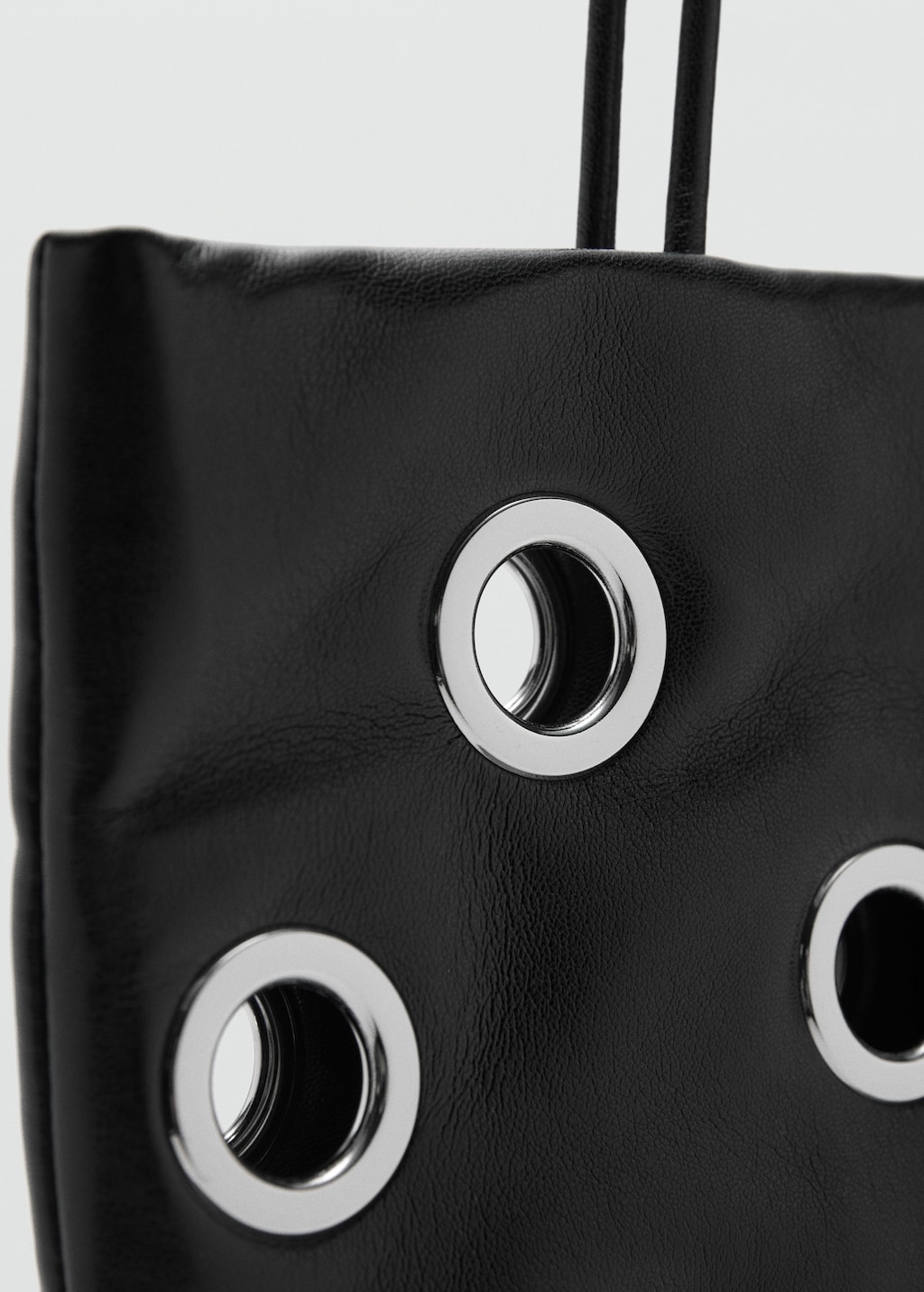 Shoulder bag with eyelets
