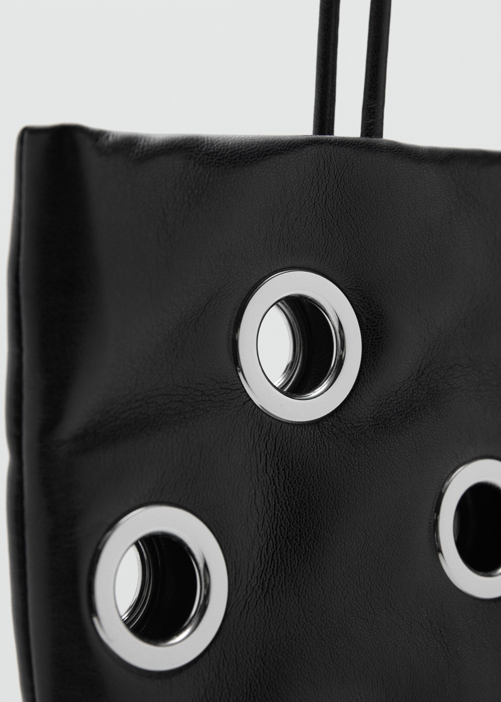 Shoulder bag with eyelets - Details of the article 1, Black. Ref: 17046740-00.