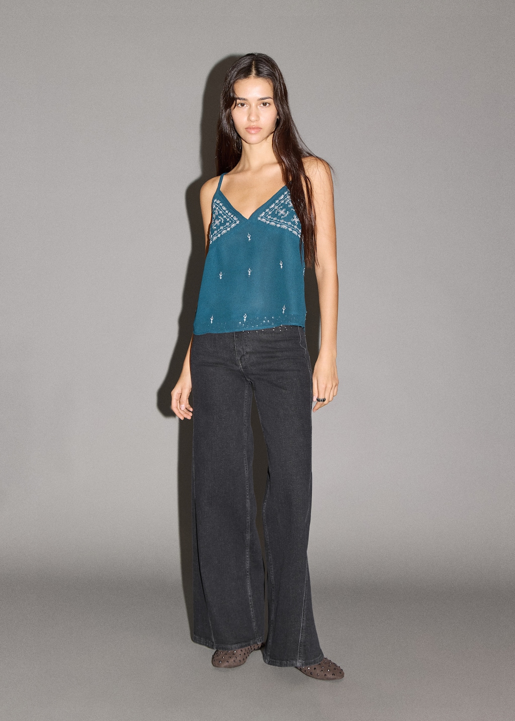 Low-waist studded jeans