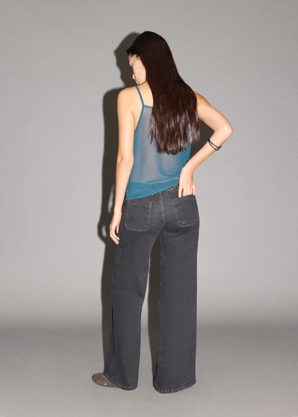 Low-waist studded jeans