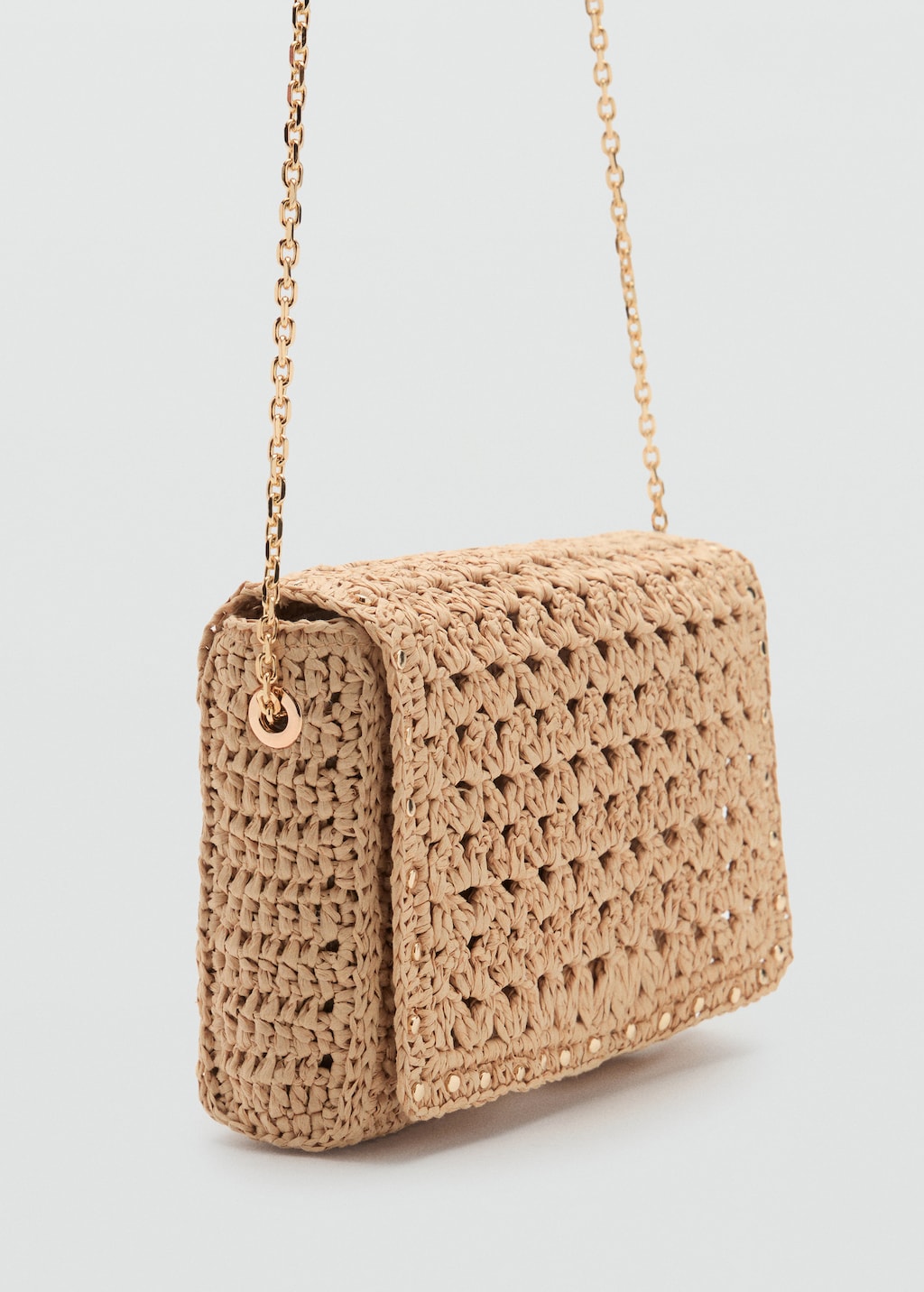 Natural fiber shoulder bag with studs